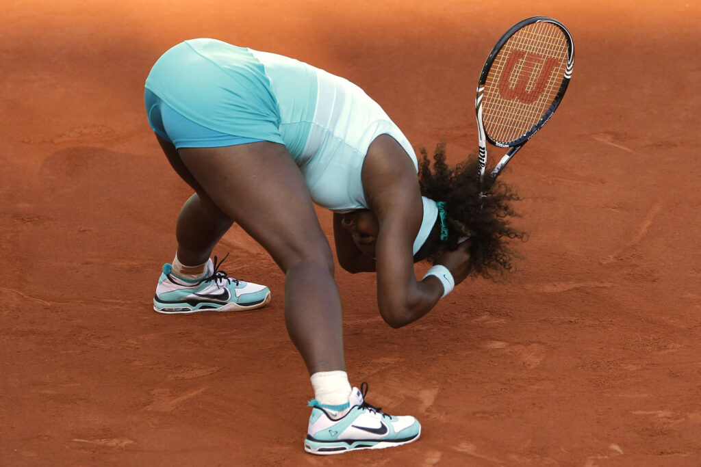 Serena Williams reacts during her defeat to Virginie Razzano at the 2012 French Open