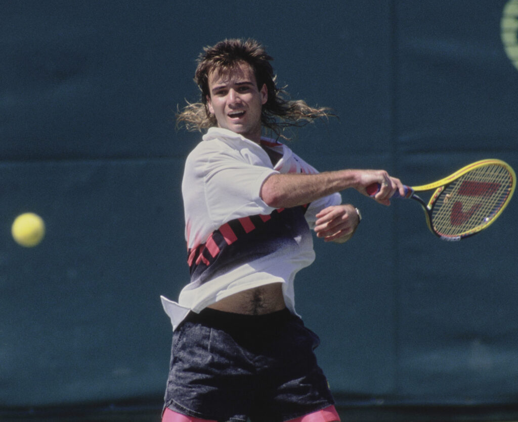 Andre Agassi hits a forehand during the 1990 Miami Open final