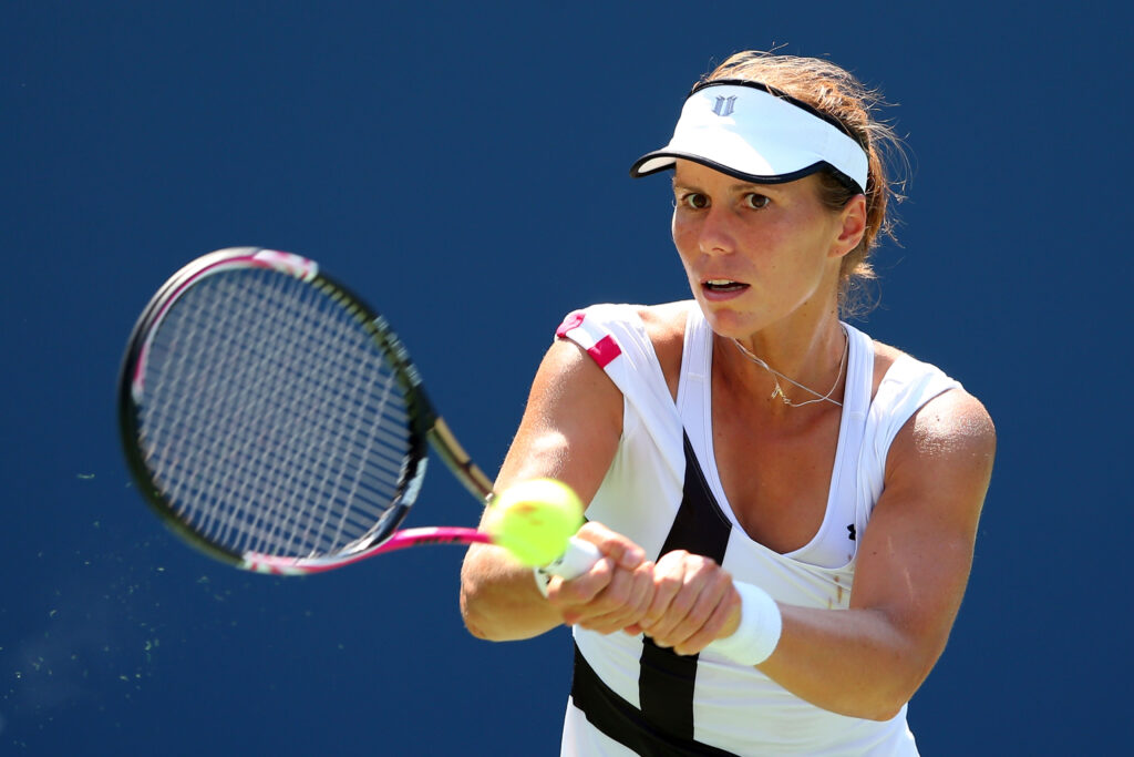Varvara Lepchenko hits a backhand against Samantha Stosur at the 2012 US Open.