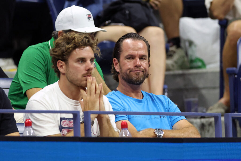 Xavier Malisse watches Alexei Popyrin play at the 2024 US Open