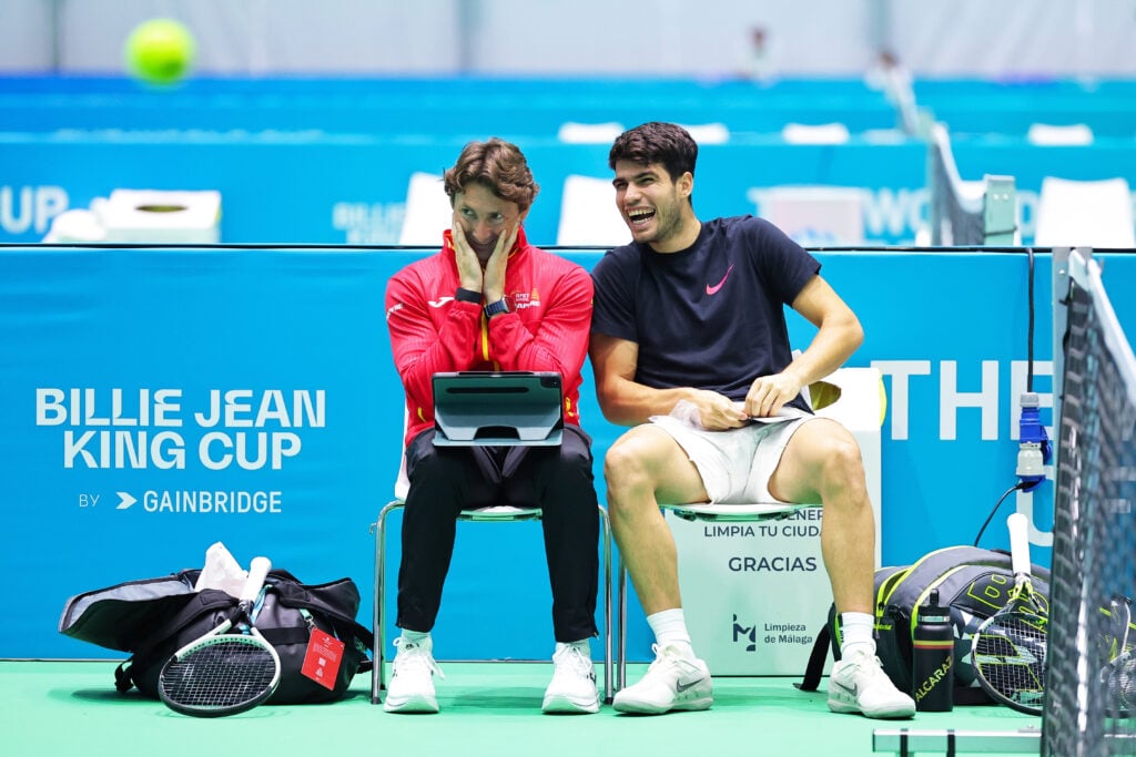 Juan Carlos Ferrero and Carlos Alcaraz sit beside one another