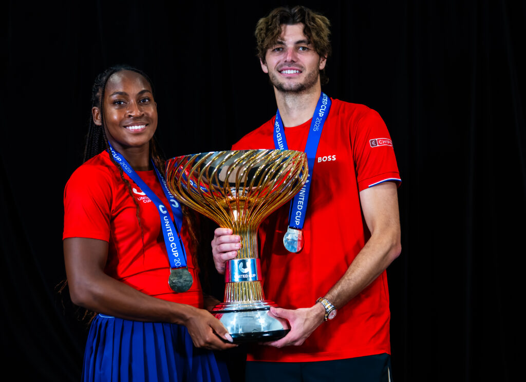 Coco Gauff of the United States and Taylor Fritz of the United States pose with the champions trophy after defeating Team Poland in the final on Day 10 of the 2025 United Cup at Ken Rosewall Arena on January 05, 2025 in Sydney, Australia
