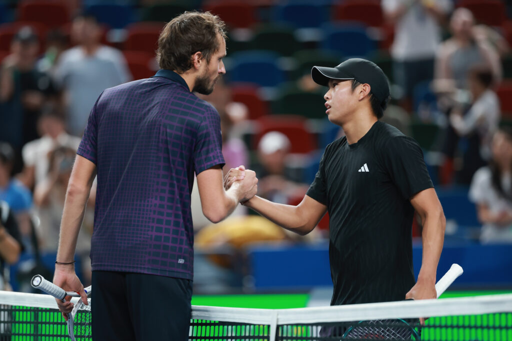 Daniil Medvedev and Learner Tien shake hands at the net