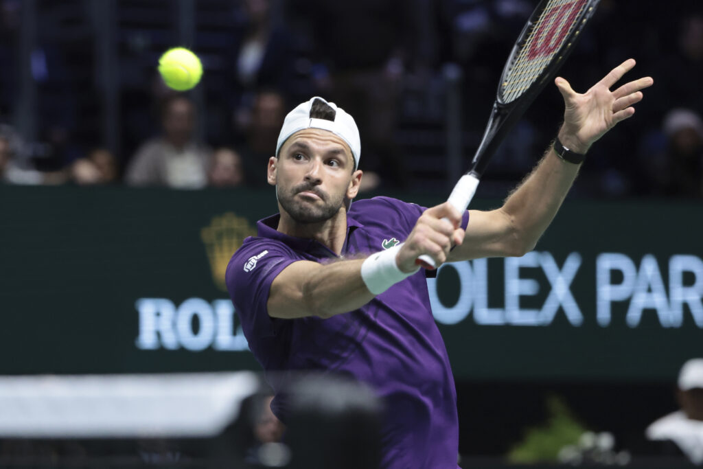 Grigor Dimitrov hits a backhand at the 2025 Paris Masters