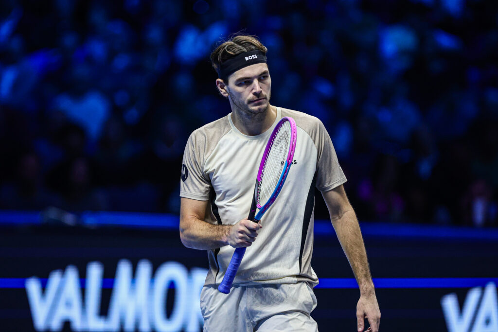Taylor Fritz gestures with his racket in celebration
