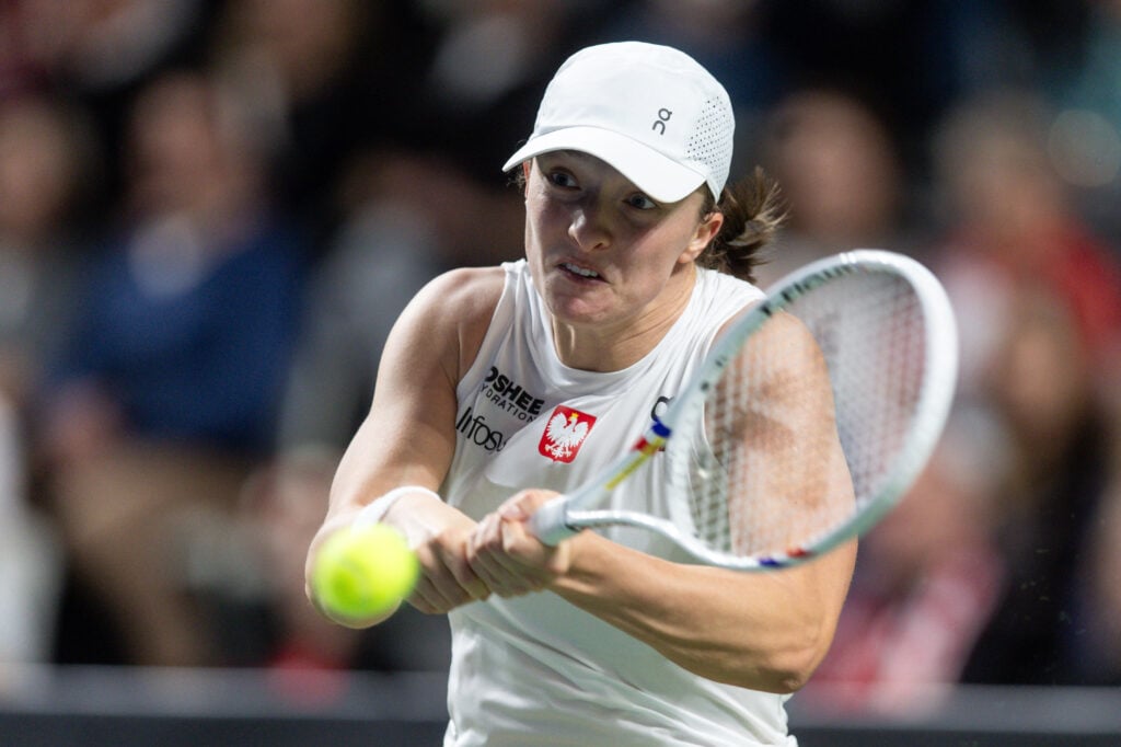 Iga Swiatek hitting a backhand during her match in Poland's Billie Jean King Cup tie against Romania.