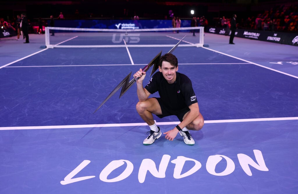 Alex de Minaur celebrates with the trophy at the UTS London Grand Final 2025