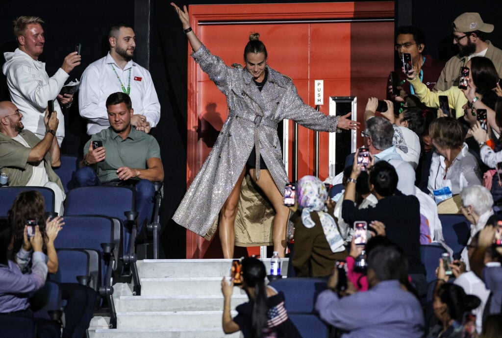 Belarus' Aryna Sabalenka makes her way to the court prior to her Battle of the Sexes exhibition tennis match against Australia's Nick Kyrgios in Dubai on December 28, 2025.