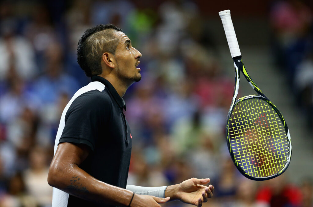 Nick Kyrgios throws his racket in the air at the 2015 US Open.