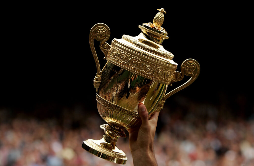 Roger Federer lifts the Wimbledon trophy in the air after winning in 2005