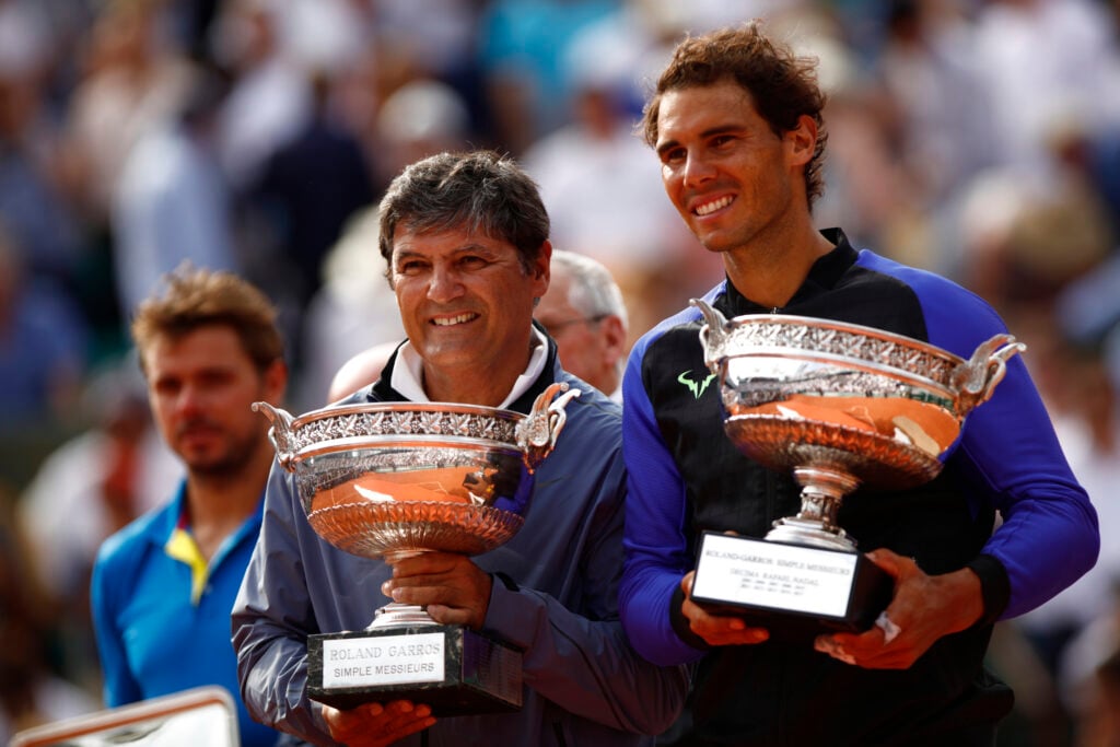 Toni and Rafael Nadal pose with the French Open trophy