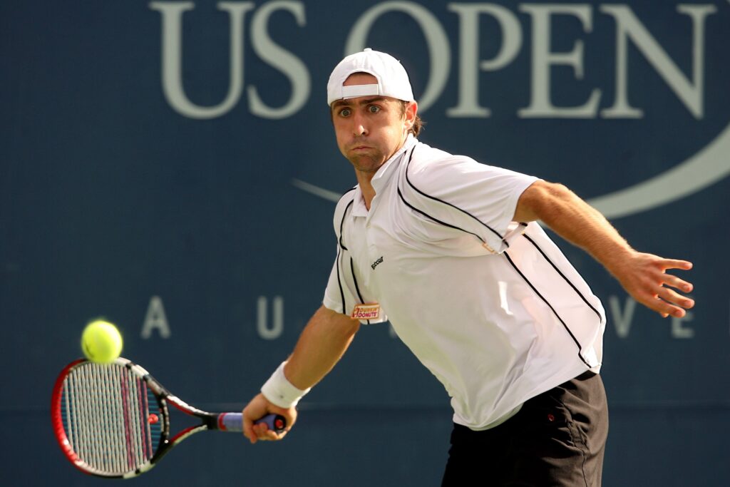 Benjamin Becker hits a forehand against Andy Roddick at the 2006 US Open.