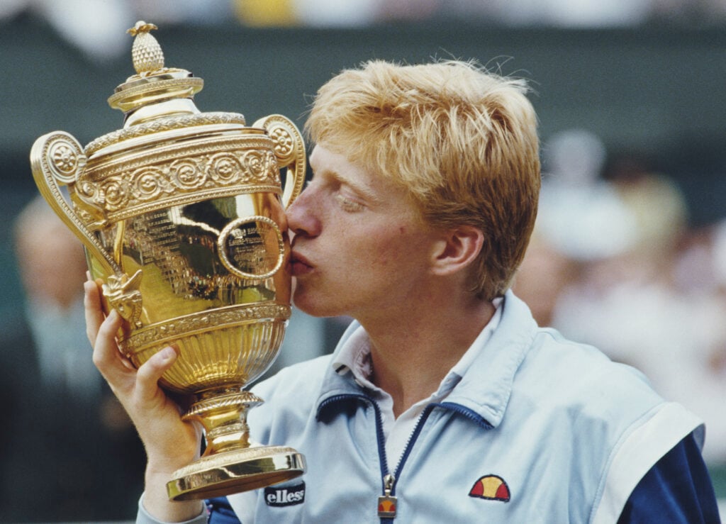 Boris Becker kisses the Wimbledon trophy after winning in 1985