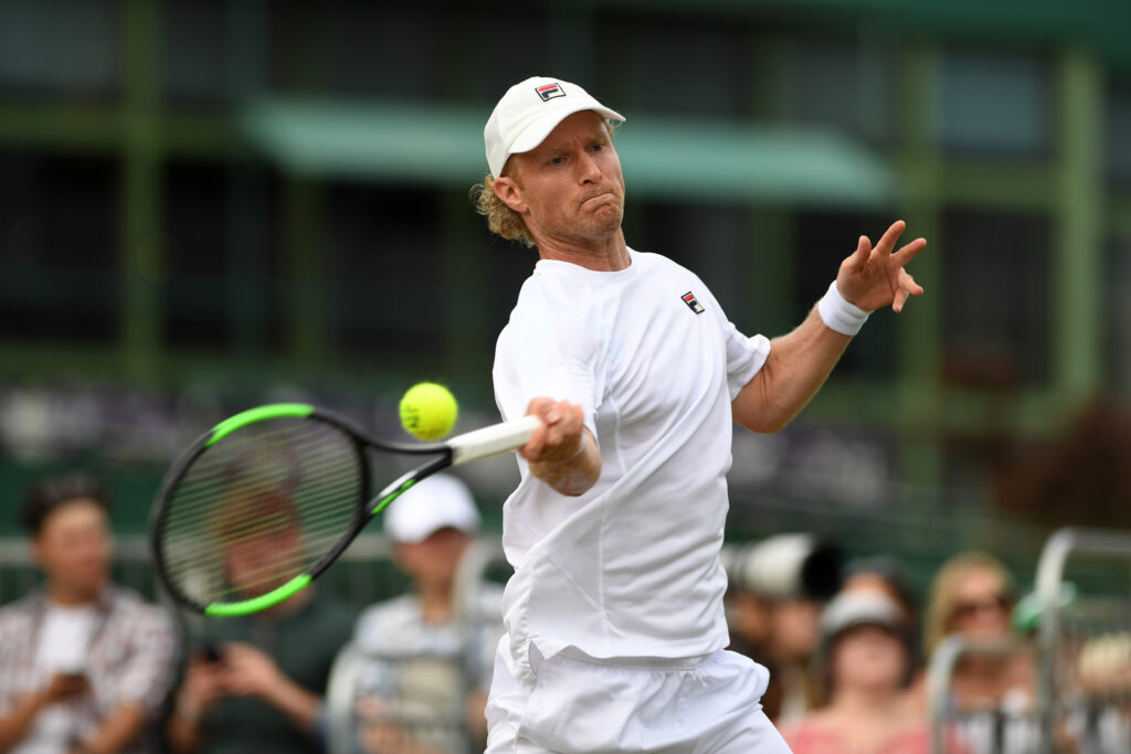 Dmitry Tursunov hits a forehand during his mixed doubles match at Wimbledon in 2017.