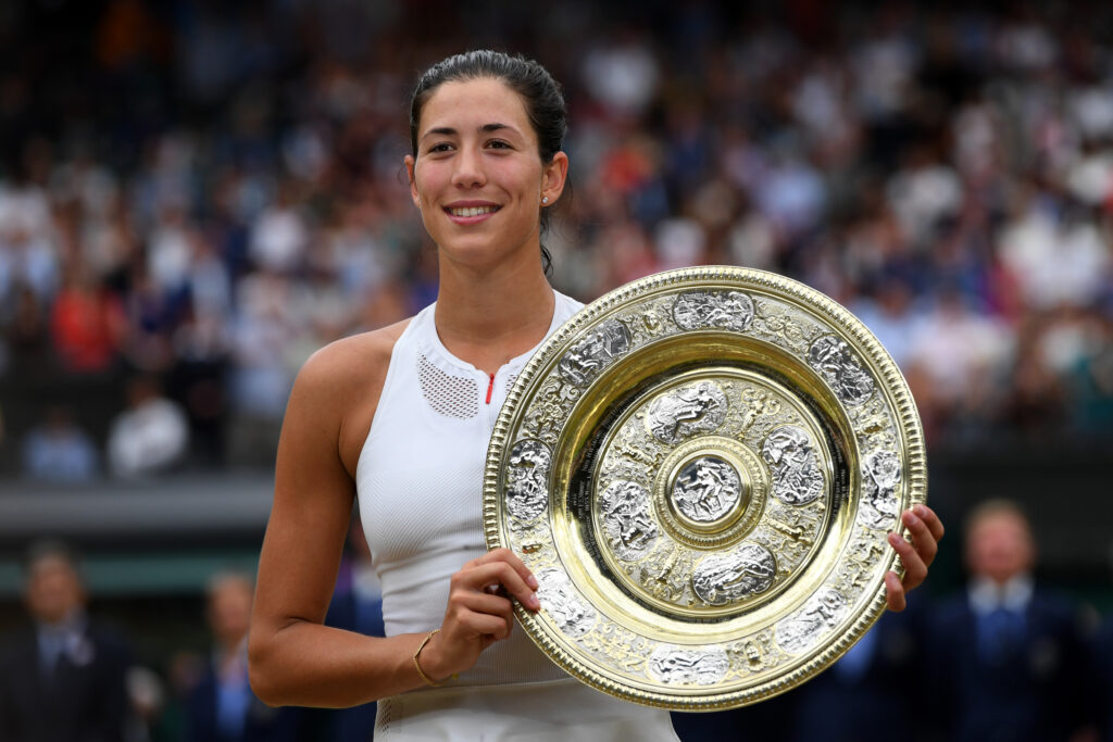 Garbine Muguruza celebrates with the Wimbledon title in 2017