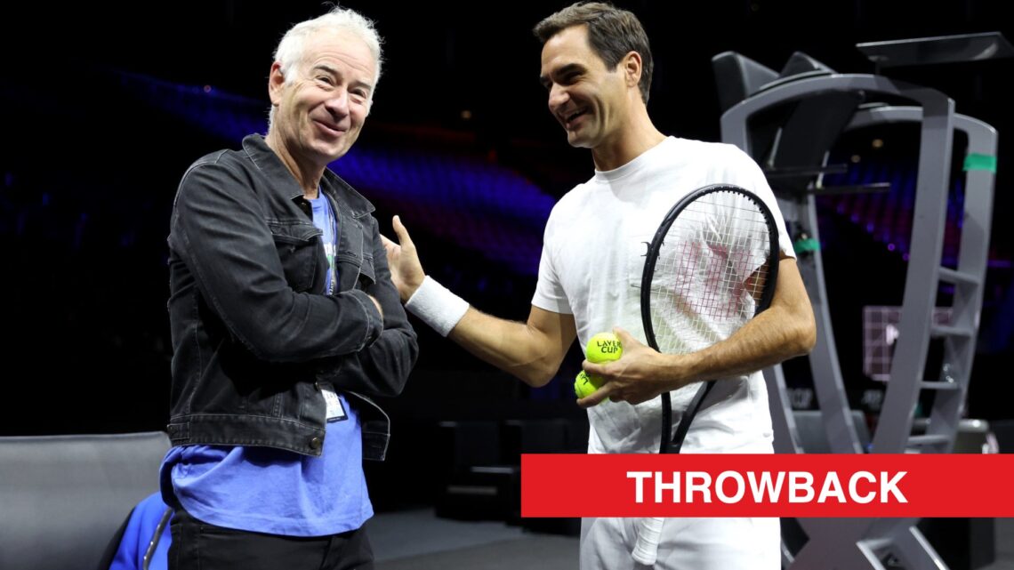 Roger Federer and John McEnroe talking at the 2022 Laver Cup, with a throwback label.