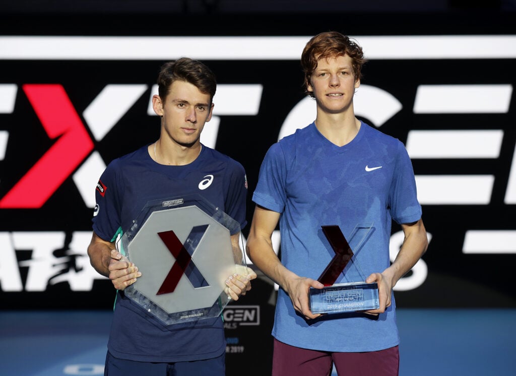 Alex de Minaur and Jannik Sinner pose with their Next Gen titles in 2019