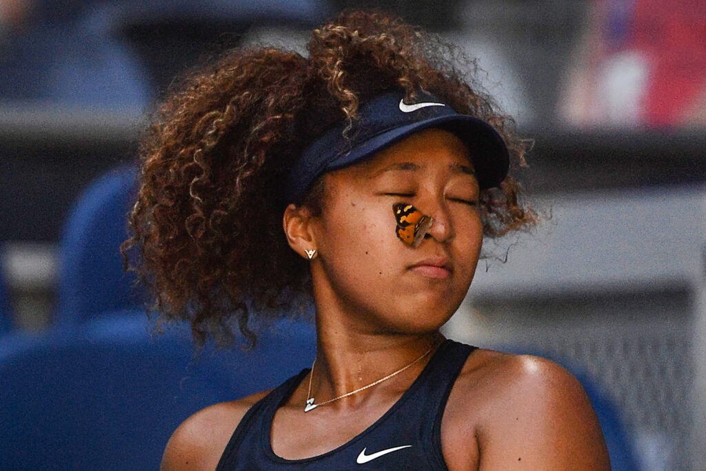 A butterfly lands on Naomi Osaka during the 2021 Australian Open