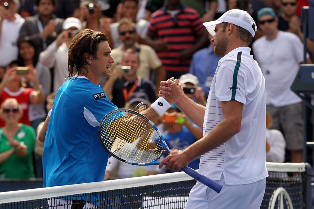 David Ferrer and Andy Roddick shake hands after their match at the 2011 US Open