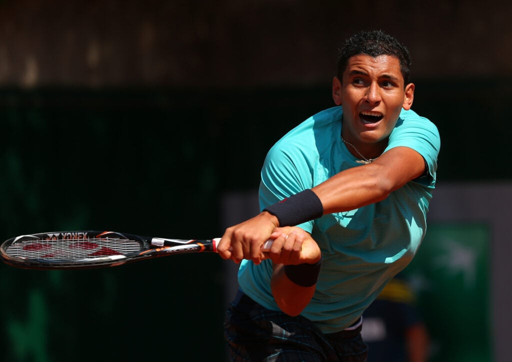 Nick Kyrgios hits a backhand at the 2013 French Open