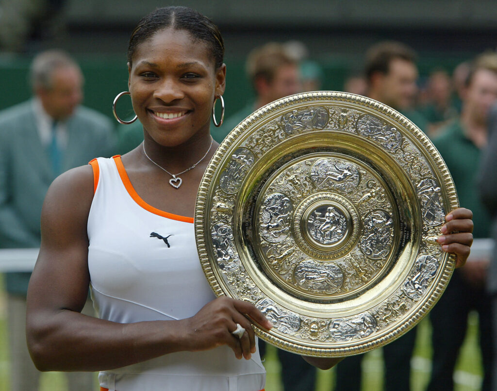 Serena Williams holds the Wimbledon trophy in 2003.