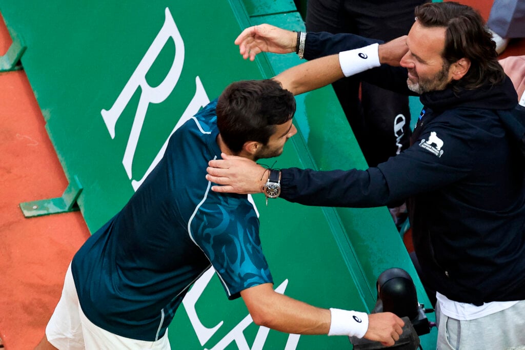 Lorenzo Musetti and Simone Tartarini share a hug at the 2025 Monte-Carlo Masters