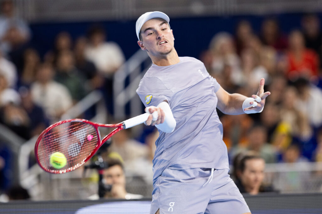 Joao Fonseca hits a forehand during an exhibition match with Carlos Alcaraz