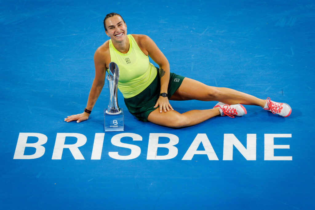 Aryna Sabalenka celebrates with the trophy after winning the 2026 Brisbane International.