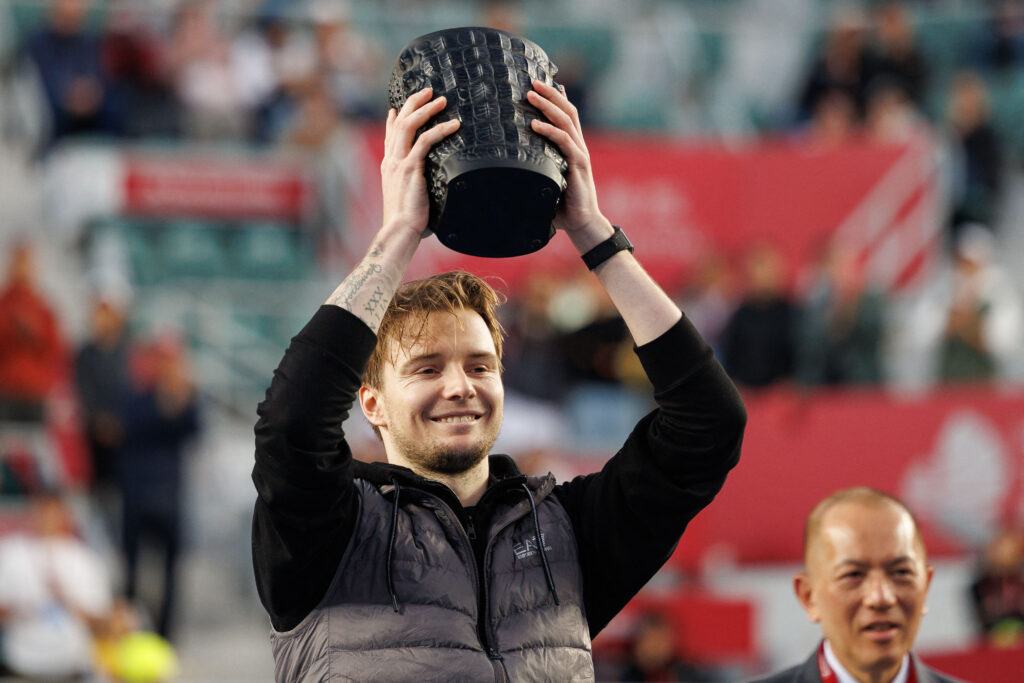 Alexander Bublik celebrates with the trophy after his victory at the 2026 Hong Kong Tennis Open.