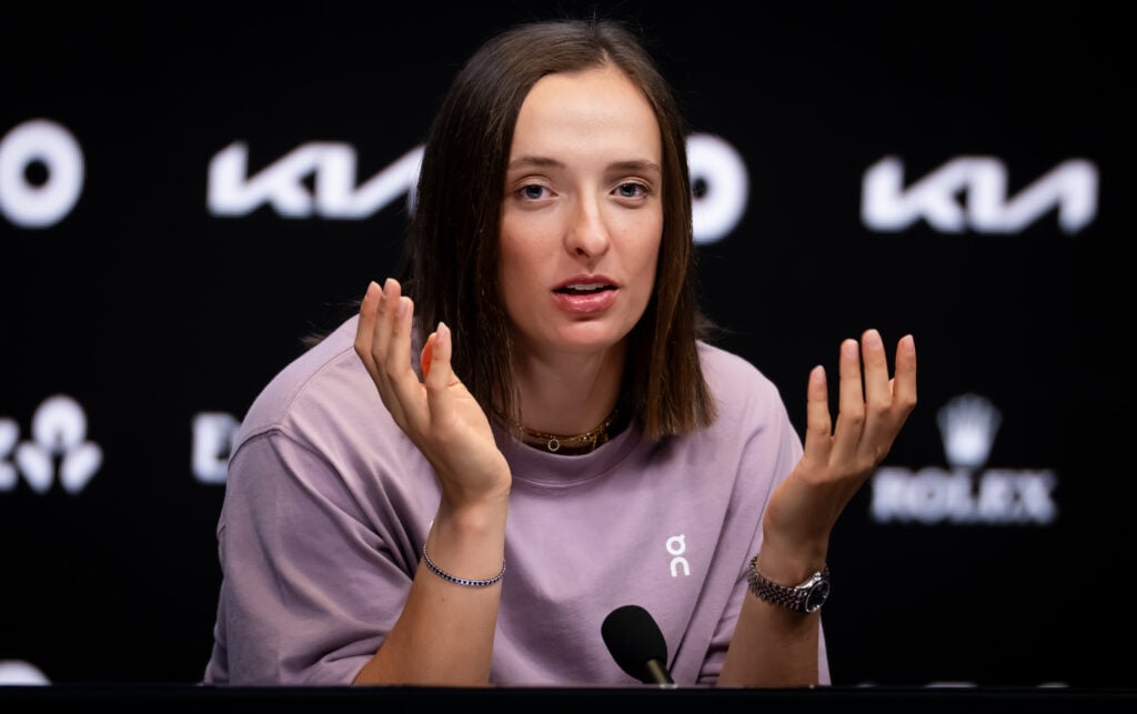Iga Swiatek reacts at an Australian Open press conference.