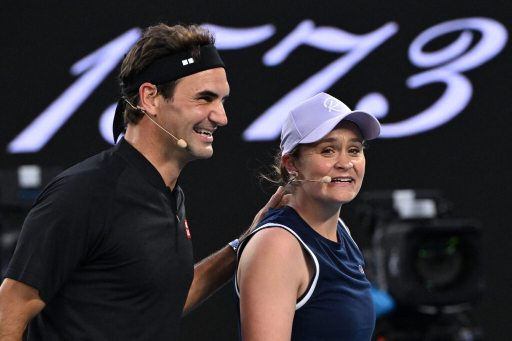 Ashleigh Barty and Roger Federer react during an exhibition match at the Australian Open in 2026.