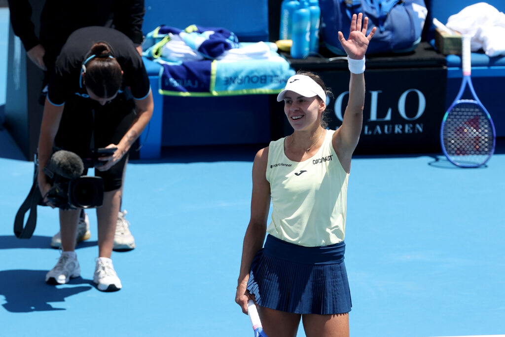 Magda Linette celebrates victory over Emma Navarro at the 2026 Australian Open.