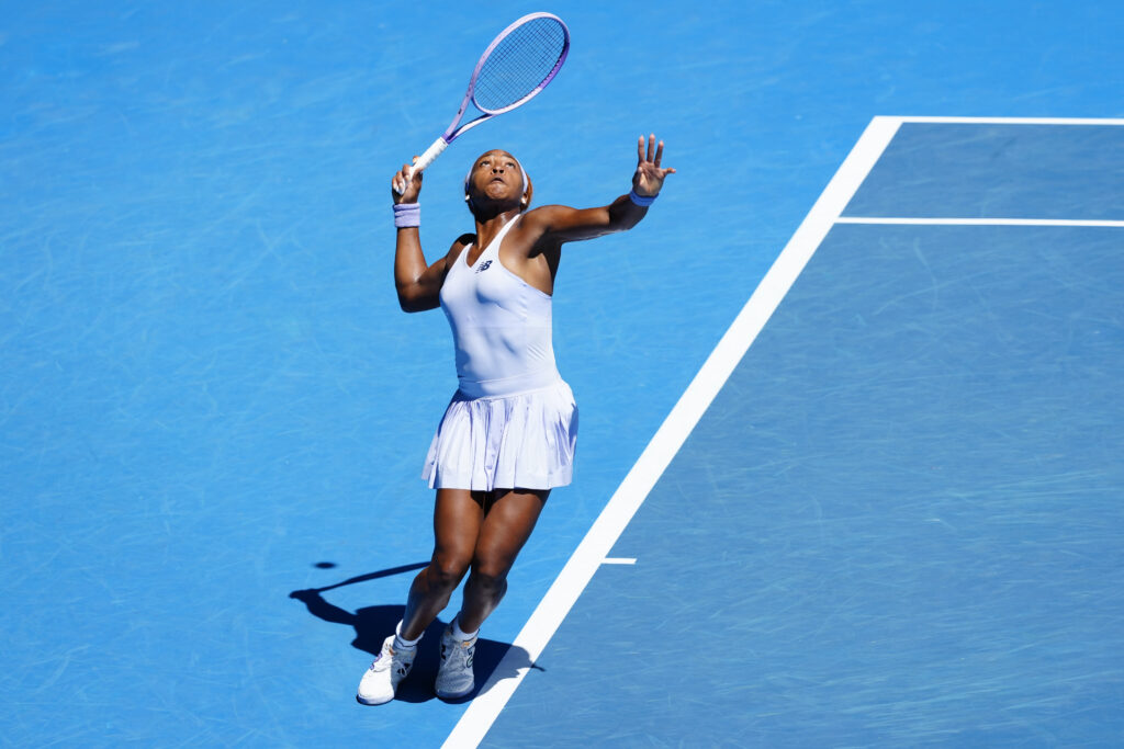 Coco Gauff hits a serve against Kamilla Rakhimova at the 2026 Australian Open.