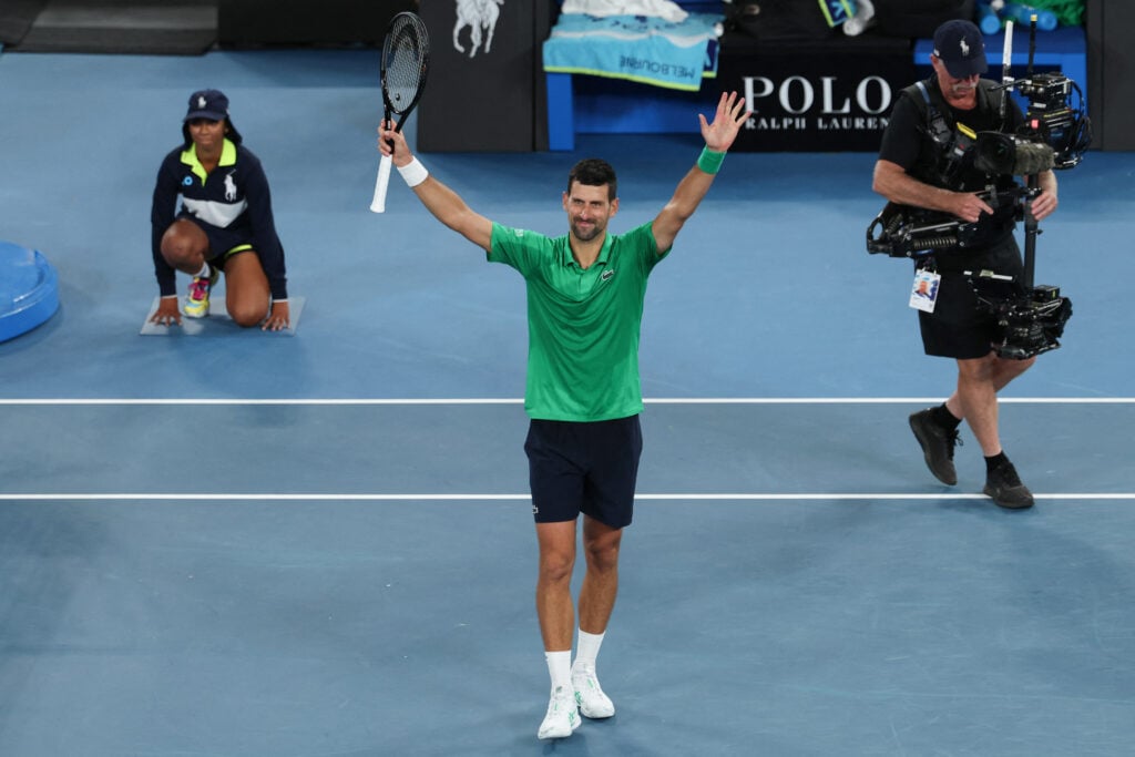 Novak Djokovic celebrates after winning his first-round match at the 2026 Australian Open.
