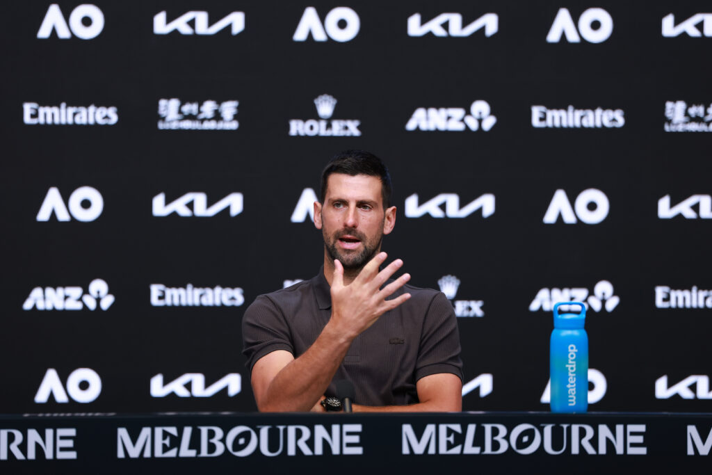 Novak Djokovic gestures at a press conference at the 2026 Australian Open