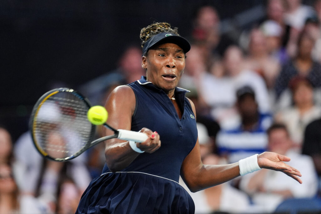 Venus Williams of the United States plays a forehand in the Women's Singles First Round match against Olga Danilovic of Servbia during day one of the 2026 Australian Open at Melbourne Park on January 18, 2026 in Melbourne, Australia.