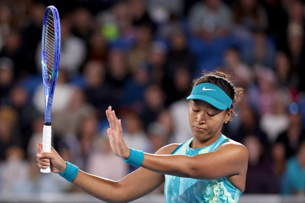 Naomi Osaka holds up her hands in apology during the 2026 Australian Open
