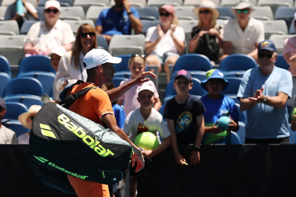 Felix Auger-Aliassime leaves the court after retiring injured from his first round match at the 2026 Australian Open against Nuno Borges.