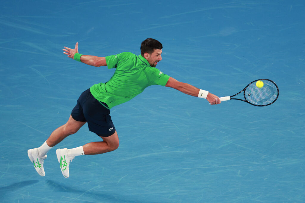 Novak Djokovic stretches for a backhand