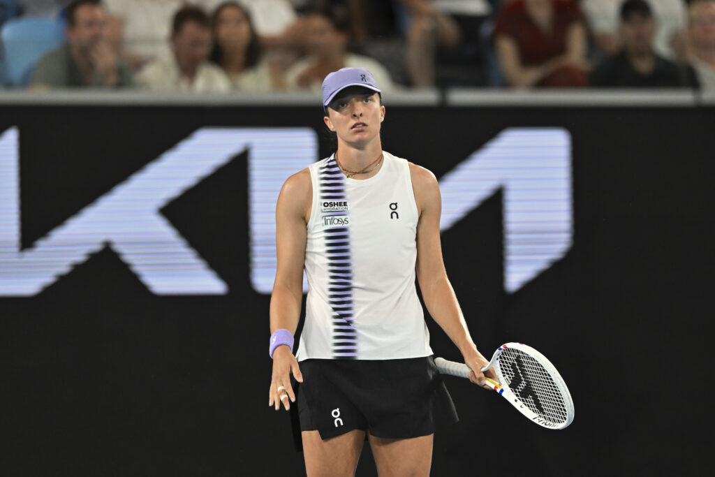 Iga Swiatek reacts after missing a shot against Anna Kalinskaya at the 2026 Australian Open.