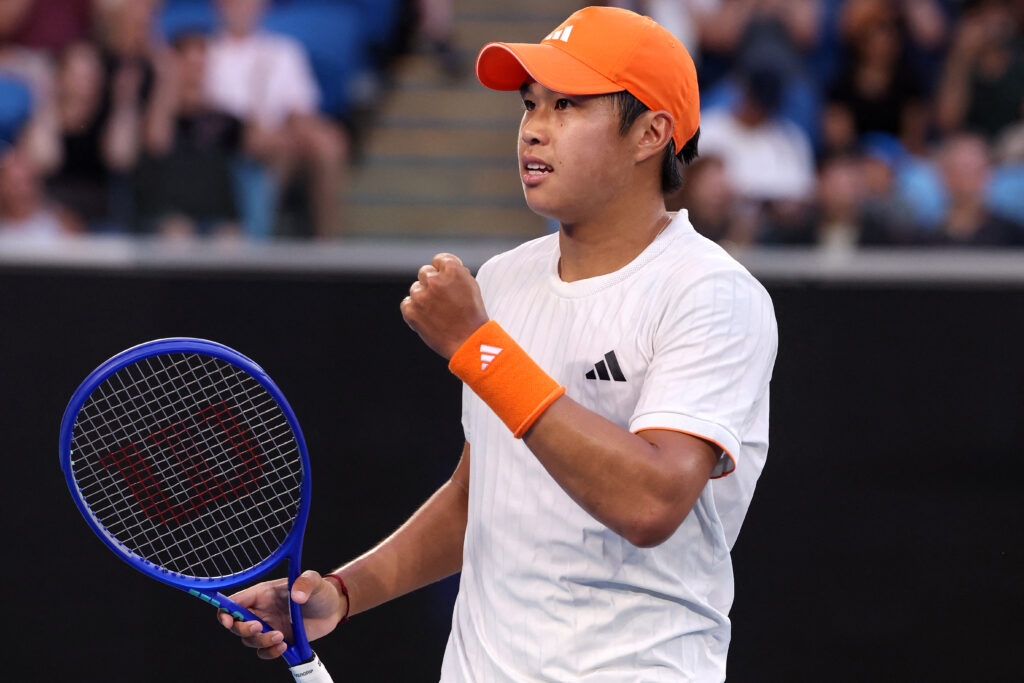 Learner Tien pumps his fist at the Australian Open.