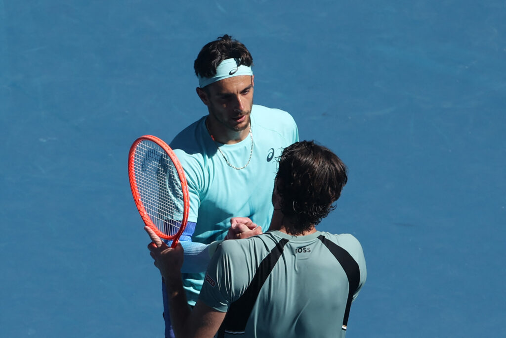 Lorenzo Musetti and Taylor Fritz shake hands after their match at the 2026 Australian Open