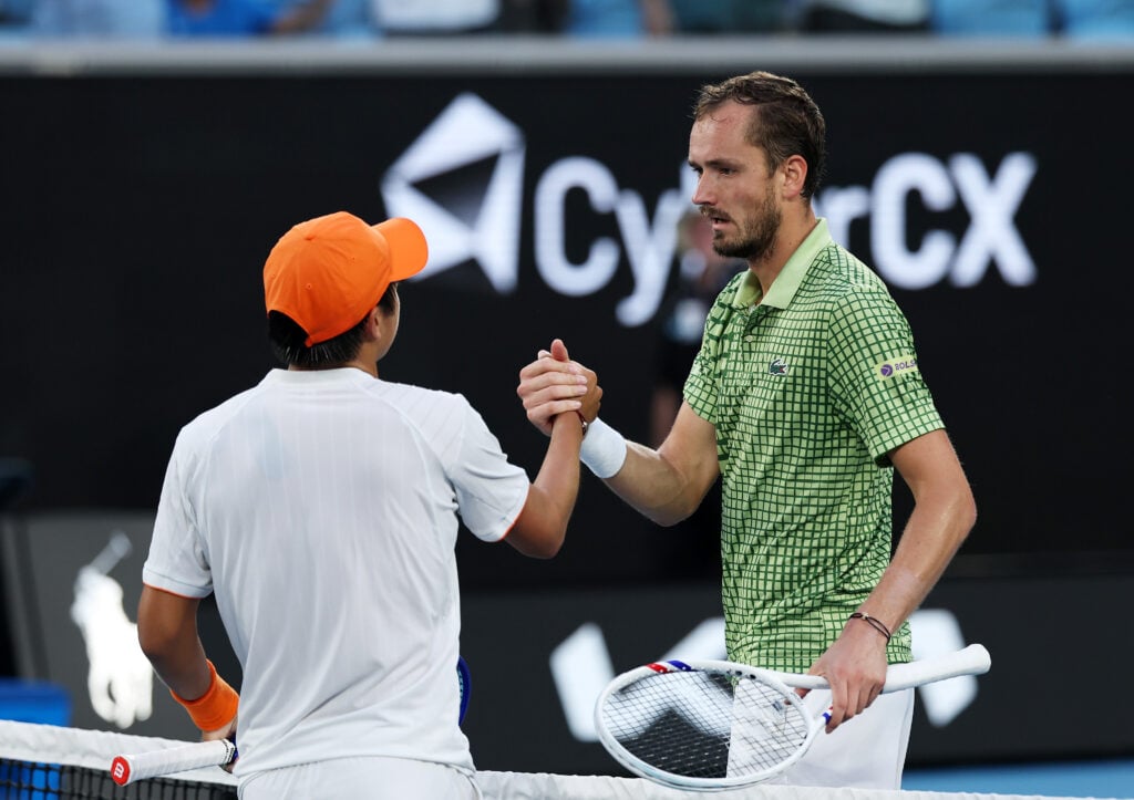 Learner Tien and Daniil Medvedev shake hands after their match at the 2026 Australian Open.