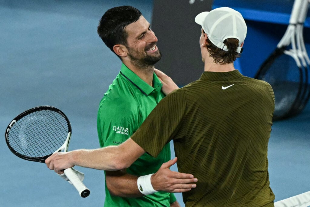 Novak Djokovic and Jannik Sinner embrace after their semifinal match at the 2026 Australian Open