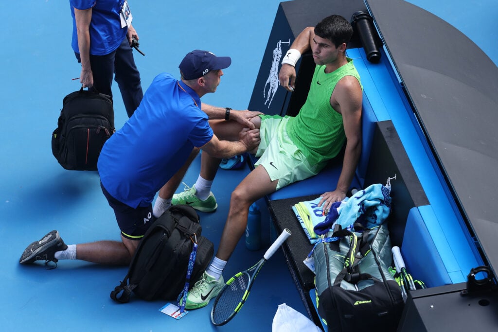 Carlos Alcaraz receives treatment against Alexander Zverev at the Australian Open