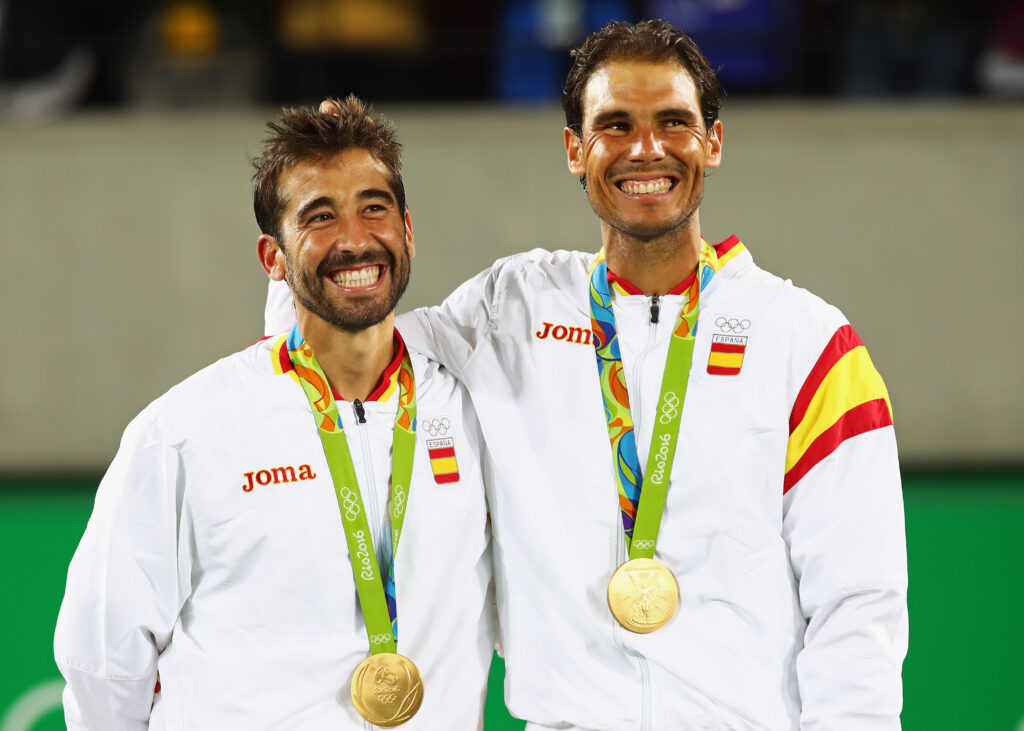 Rafael Nadal and Marc Lopez celebrate on the podium after winning gold at the Rio Olympics in 2026.