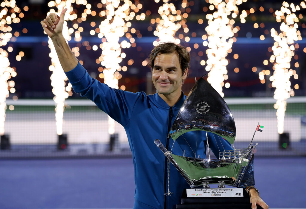 Roger Federer holding the Dubai Tennis Championships title in 2019.