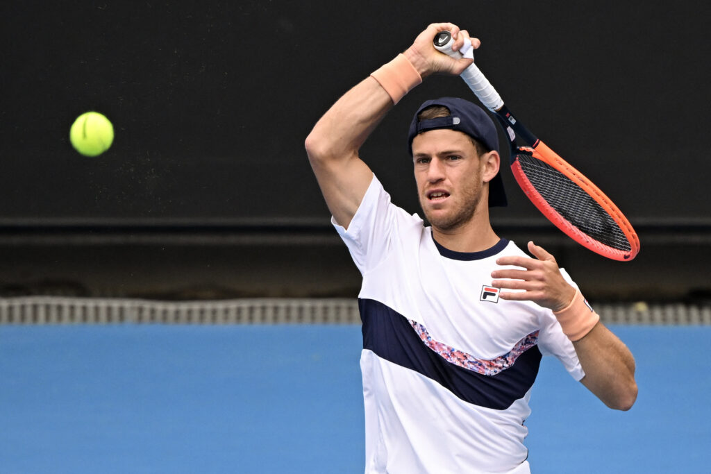 Diego Schwartzman hitting a return at the 2023 Australian Open.