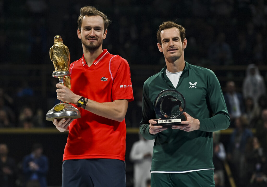 Daniil Medvedev and Andy Murray hold their trophies after the Qatar Open final in 2023.