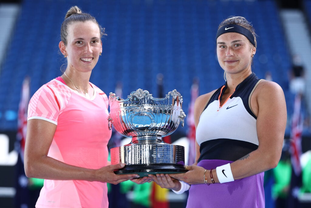 Elise Mertens and Aryna Sabalenka posing with the Australian Open doubles title in 2021.